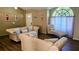 Comfortable living room with a beige couch, chaise lounge, and natural light at 4830 Red Bay Dr, Orlando, FL 32829