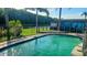 Fenced in backyard pool with a view of the lake at 4830 Red Bay Dr, Orlando, FL 32829