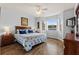 The main bedroom is a serene retreat with natural light and stylish decor at 504 Terrace Ridge # 311, Davenport, FL 33896