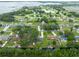 An aerial view of a sprawling community with many waterways, interspersed with lush trees and landscaping at 6161 Bass Hwy, St Cloud, FL 34771
