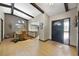 Inviting entryway with dining area, wood beams, and a view of the kitchen at 6161 Bass Hwy, St Cloud, FL 34771
