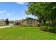 Charming single-story home featuring a stone facade, well-manicured lawn, and a long driveway at 6161 Bass Hwy, St Cloud, FL 34771