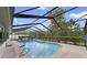 Sparkling swimming pool with screened enclosure and ample deck space for lounging at 6161 Bass Hwy, St Cloud, FL 34771