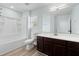 Clean bathroom with vanity, shower, and a modern toilet at 6905 Beargrass Rd, Harmony, FL 34773