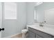 Modern bathroom with white vanity and tiled flooring at 6905 Beargrass Rd, Harmony, FL 34773
