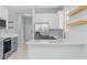 Modern kitchen with stainless steel appliances and bright white countertop at 6905 Beargrass Rd, Harmony, FL 34773