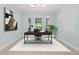 Bright office space with large windows, neutral walls, and minimalist décor at 6905 Beargrass Rd, Harmony, FL 34773