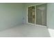 Back patio with concrete flooring and sliding glass doors leading to the home's interior at 6905 Beargrass Rd, Harmony, FL 34773