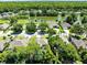 Neighborhood shot with lush landscaping, and a large pond to be enjoyed at 716 Timberwilde Ave, Winter Springs, FL 32708