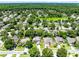 A lushly landscaped community has beautiful homes and calm waters at 716 Timberwilde Ave, Winter Springs, FL 32708