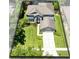 This home features a beautifully landscaped lawn, a neutral color scheme, and a two car garage at 716 Timberwilde Ave, Winter Springs, FL 32708