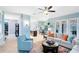 Open-concept living room with stylish furniture, colorful rug, and seamless flow to the kitchen at 716 Timberwilde Ave, Winter Springs, FL 32708