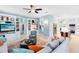 Open living space showcases built-ins with entertainment center and a view into the kitchen at 716 Timberwilde Ave, Winter Springs, FL 32708