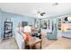 Comfortable living room with built-in shelving, a ceiling fan, and contemporary decor at 716 Timberwilde Ave, Winter Springs, FL 32708