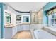 Luxurious main bathroom with dual sinks, a soaking tub, and a walk-in shower at 716 Timberwilde Ave, Winter Springs, FL 32708