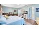 Spacious main bedroom featuring wood floors, a walk-in closet, and ensuite bathroom access at 716 Timberwilde Ave, Winter Springs, FL 32708