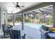 Covered patio featuring a ceiling fan, outdoor seating, BBQ grill, and a view of the pool at 716 Timberwilde Ave, Winter Springs, FL 32708