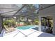 Beautiful screened in pool featuring lounge chairs, outdoor seating, and a gray exterior at 716 Timberwilde Ave, Winter Springs, FL 32708