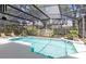 Sparkling screened-in pool area with lounge chairs and a beautiful garden view provides ultimate relaxation at 716 Timberwilde Ave, Winter Springs, FL 32708