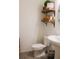 Clean powder room with open shelving, decorative accents, and a pedestal sink at 721 Benoi Dr, Davenport, FL 33896