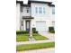 Charming two-story home with a well-manicured lawn and an attached one car garage at 721 Benoi Dr, Davenport, FL 33896