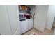 A convenient laundry area with washer, dryer, and storage shelves at 721 Benoi Dr, Davenport, FL 33896