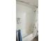 A modern shower boasts white subway tile and glass door at 721 Benoi Dr, Davenport, FL 33896