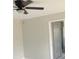 Bright bedroom with gray walls, white tile floors and a ceiling fan at 841 Fir Ave, Frostproof, FL 33843