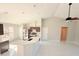 Bright kitchen features an island with quartz countertops and stainless steel appliances and open concept layout at 841 Fir Ave, Frostproof, FL 33843