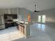 Bright, open kitchen boasts modern appliances, island with sink, and sleek countertops at 841 Fir Ave, Frostproof, FL 33843
