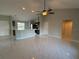 Inviting open floorplan showcases a stylish kitchen and a spacious living area with marble floors at 841 Fir Ave, Frostproof, FL 33843