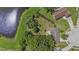 Picturesque property with a lush backyard, mature trees, and peaceful pond at 8733 Catbriar Ln, Orlando, FL 32829