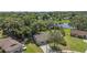 Secluded home featuring a spacious lot backed by mature trees and a pond at 8733 Catbriar Ln, Orlando, FL 32829