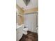 This bathroom features a white toilet and vanity and new flooring at 8733 Catbriar Ln, Orlando, FL 32829