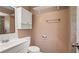 Bright bathroom features a white vanity, subway tile backsplash, and modern fixtures at 8733 Catbriar Ln, Orlando, FL 32829