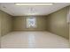This bonus room has neutral paint, tile flooring, and a ceiling fan at 8733 Catbriar Ln, Orlando, FL 32829