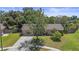 Quaint single-Gathering home with a mature shade tree and vibrant green lawn at 8733 Catbriar Ln, Orlando, FL 32829