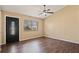 Bright living room features a modern door and a large window with natural light at 8733 Catbriar Ln, Orlando, FL 32829