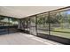 Enjoy the outdoors in this screened in porch with views of the backyard at 8733 Catbriar Ln, Orlando, FL 32829