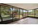 Enjoy the outdoors in this screened in porch with views of the backyard at 8733 Catbriar Ln, Orlando, FL 32829