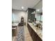 The primary bathroom offers a double vanity, and a separate soaking tub at 8986 Fullerwood Ave, Orlando, FL 32832