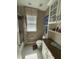 Bathroom featuring granite countertops and a shower with a tub at 8986 Fullerwood Ave, Orlando, FL 32832