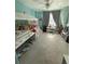 Bright bedroom with a canopy bed and a ceiling fan at 8986 Fullerwood Ave, Orlando, FL 32832
