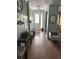 Inviting entryway with hardwood floors, bench seating, and stylish decor at 8986 Fullerwood Ave, Orlando, FL 32832