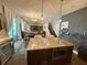 Modern kitchen showcasing a center island, open layout, and seamless flow to living spaces at 8986 Fullerwood Ave, Orlando, FL 32832