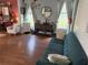 Comfortable living room with a blue sofa, stylish decor, and ample natural light at 8986 Fullerwood Ave, Orlando, FL 32832