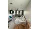 Spacious living room is decorated with comfortable sofas, chairs, and a ceiling fan at 8986 Fullerwood Ave, Orlando, FL 32832