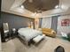 Relaxing main bedroom suite boasts tray ceilings, a sitting area, and modern decor at 8986 Fullerwood Ave, Orlando, FL 32832