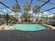 Covered pool featuring a waterfall, plants, and ample space for relaxing at 8986 Fullerwood Ave, Orlando, FL 32832