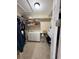 Spacious walk-in closet offers ample storage space with shelves, drawers, and hanging rods at 8986 Fullerwood Ave, Orlando, FL 32832